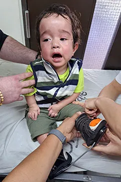 A baby's foot being examined